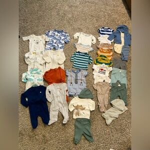 Big bundle of newborn baby clothes